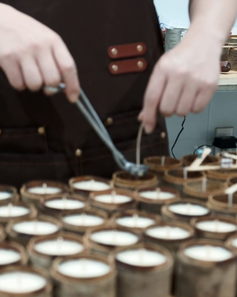The ZUNGZA workshop in Van Phuc craft village — A candle jar begins with a soybean