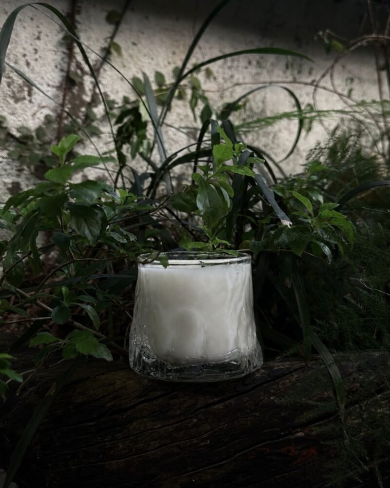 ZUNGZA Song Sanh glass candle burning on a table — Scent enters memory by the shortest road