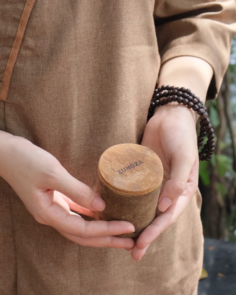 A ZUNGZA cinnamon bark candle burning at home — Woodsmoke and an evening by the stove