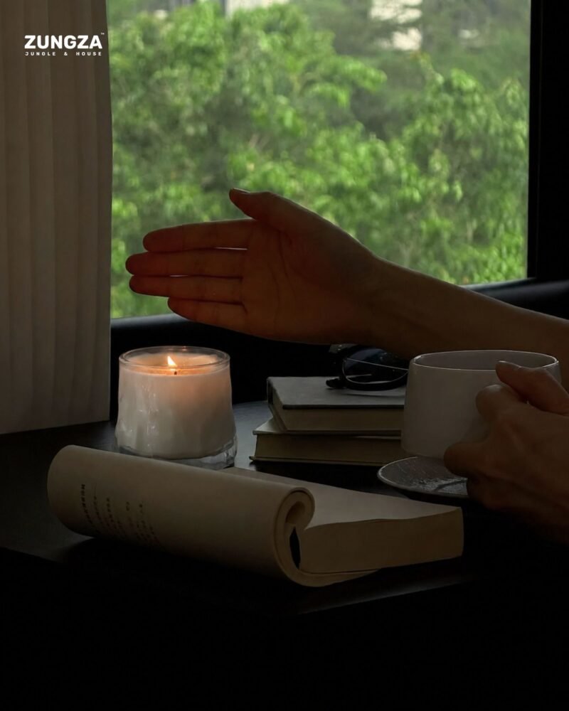 ZUNGZA Song Sanh glass candle burning on a table — Burning a candle at home, and safety told plainly